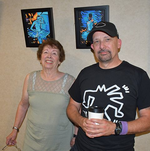 Ron Hall and his mother, JoAnn Wilson, in front of Hall’s acrylic diptych titled “Reflections Before the Dance.” Photo by Rick Sloan