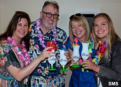 Dentists Gabrielle Rasi and Kevin Tanner share an exotic toast with Angela Gitt and Sarah Hemmen.